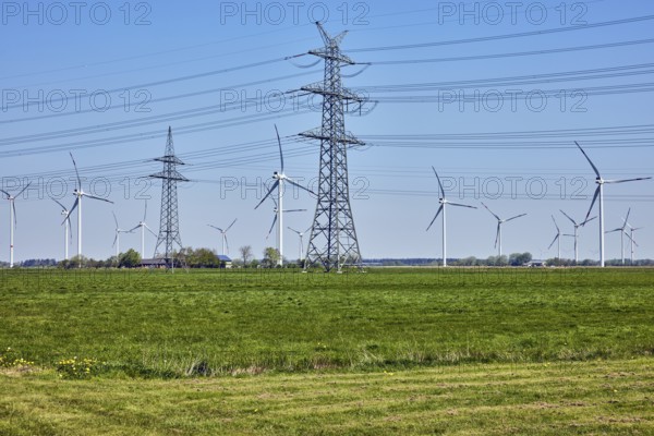 Wind turbines, high-voltage pole, high-voltage line, meadows, trees, Stadionstraße, Risum-Lindholm, Nordfriesland district, Schleswig-Holstein, Germany