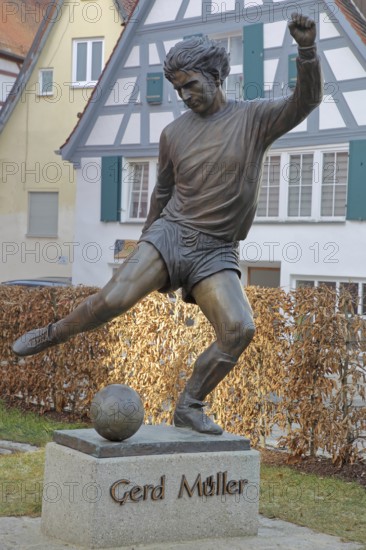 Memorial to soccer player Gerd Müller, German national team player, soccer legend, bronze sculpture, inscription, Gerd-Müller-Platz, Nördlingen, Bavaria, Germany