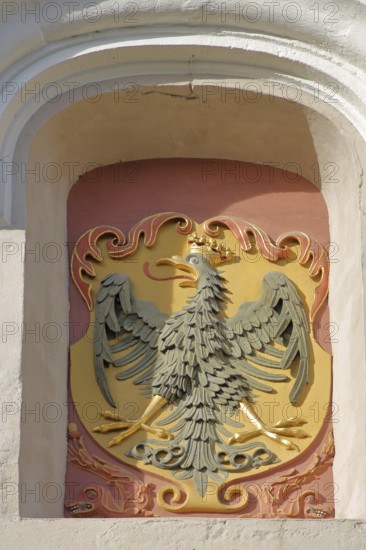 City coat of arms with eagle figure and crown, Reimlinger Tor, Nördlingen, Bavaria, Germany