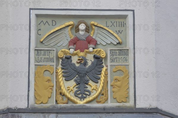 City coat of arms at the former Holy Spirit Hospital building built in 1564, inscription, year, eagle figure, heraldic animal, care center, Bürgerheim, Nördlingen, Bavaria, Germany
