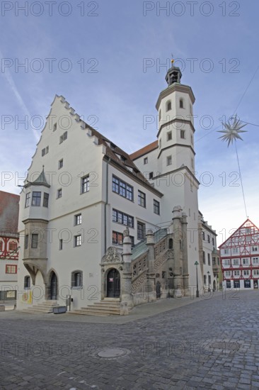 Town Hall built 1500, Renaissance Christmas star as Christmas decoration marketplace, Nördlingen, Bavaria, Germany