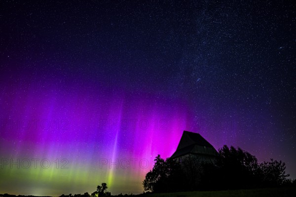 Colourful polar lights over the EXPO observatory in front of a starry night, EXPO Observatory, Oberholsten, Melle, Lower Saxony, Germany