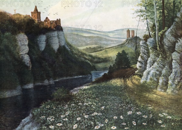 Breakthrough of the Saale near Rudelsburg, Thuringia, Saxony-Anhalt, Germany, picturesque landscape with castle on rocks, river in the valley and blooming meadow in the foreground, authentic reproduction of a school mural, historic, around 1900