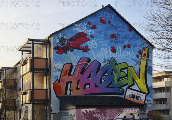 Street art with the music theme Neue Deutsche Welle on a house façade, apartment building in the Vorhalle district, Hagen, Ruhr area, North Rhine-Westphalia, Germany