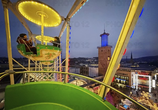 View of the town hall tower with the Christmas market from a Ferris wheel gondola, Hagen, Ruhr area, North Rhine-Westphalia, Germany