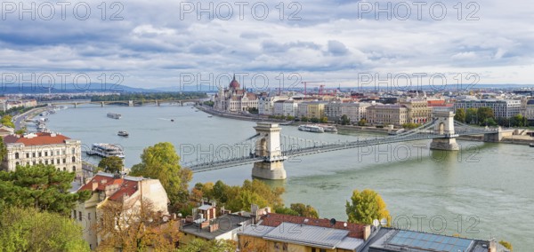 Hungarian parliament along the Danube River and Chain Bridge, Budapest, Hungary