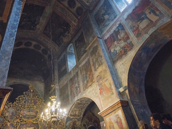Picturesque religious scenes on walls and vaults illuminated by natural light in the church, Bodbe monastery, Sighnaghi, Signagi, Kakheti province, Greater Caucasus, Georgia, Western Asia