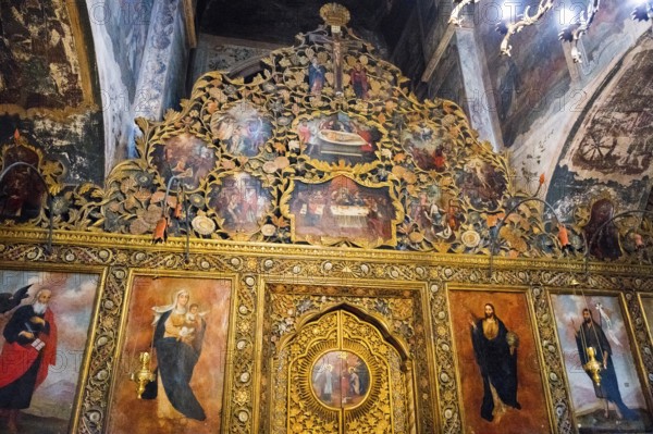 Artistically decorated icon wall with golden elements and religious representations in a church, Bodbe monastery, Sighnaghi, Signagi, Kakheti province, Greater Caucasus, Georgia, Western Asia