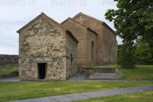 Small stone church with simple construction and rustic charm in a green setting, Batonis Ziche fortress, Telavi, Kakheti region, Georgia