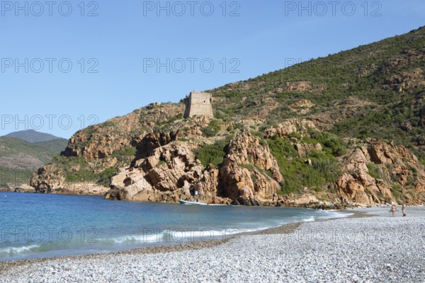 Genoese tower on the pebble beach of Porto, Ota, west coast of Corsica, Corse-du-Sud, Corsica, France
