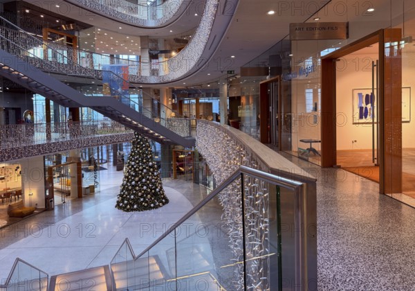 Stilwerk Düsseldorf, interior view, Christmassy decorated elliptical atrium with surrounding galleries in five sales floors, Germany