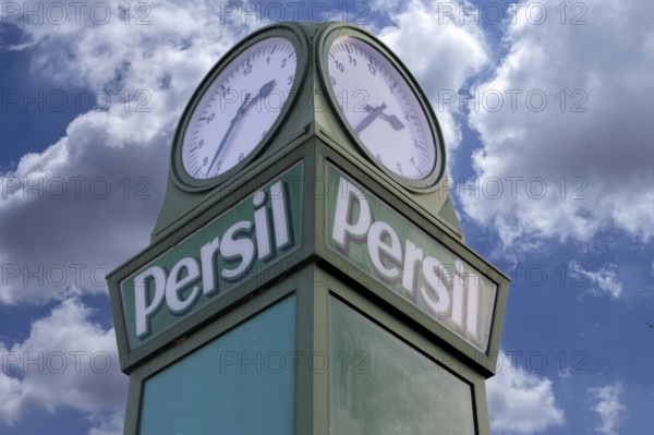 Detail of the persimmons clock, neon sign for the Henkel company, this historic persimmon clock was given away to cities in the 1920s, Fürth, Middle Franconia, Bavaria, Germany