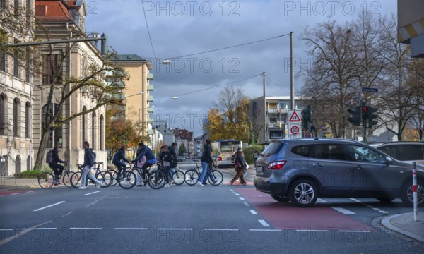 Pedestrians crossing a road junction, Erlangen, Middle Franconia, Bavaria, Germany