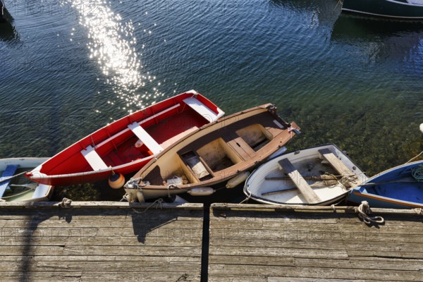 Small rowing boats moored on a wooden pier, sunny weather, view from above, Bradley Wharf, Bearskin Neck, Rockport, Cape Ann, Massachussets, New England, USA