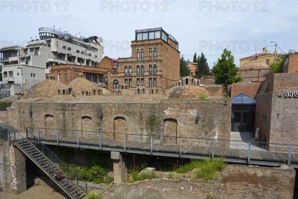 Historic brick buildings with domes in urban surroundings, sulfur baths, Abanotubani spa district, old town, Tbilisi, Tbilisi, Georgia