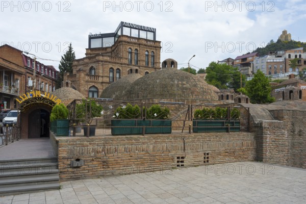 Beautiful traditional baths nestled in an urban landscape, Royal Bath, Sulphur Baths, Abanotubani Spa District, Old Town, Tbilisi, Tbilisi, Georgia