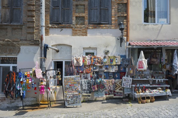 Colourful souvenir stalls along a paved street, decorative pieces and old buildings, Old Town, Sighnaghi, Signagi, Kakheti Province, Greater Caucasus, Georgia, Western Asia
