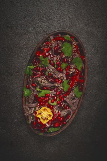 Georgian salad Tbilisi, boiled beef, with red beans and onions, sweet pepper, walnut and pomegranate, homemade, no people