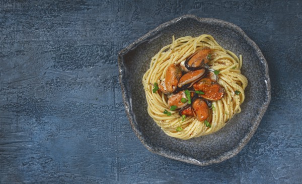 Spaghetti with mussels, without shell, pasta with peeled mussels, in carbonara sauce, micro-greens, homemade, no people