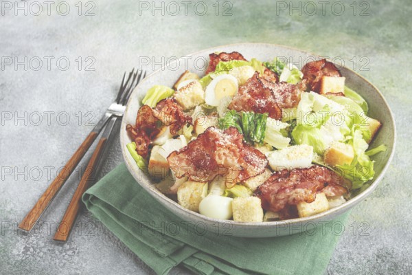 Caesar salad with fried bacon, quail eggs, homemade, no people