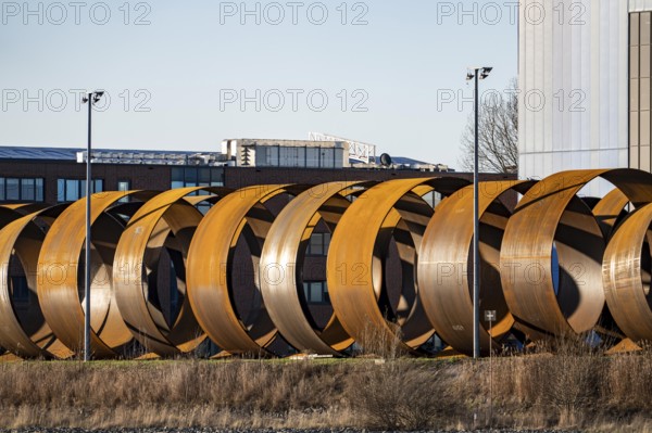 Parts for foundations for offshore wind turbines Monopiles and Single Piece Foundations, in the Steelwind satellite warehouse in Nordenham, at the mouth of the Weser, Lower Saxony, Germany