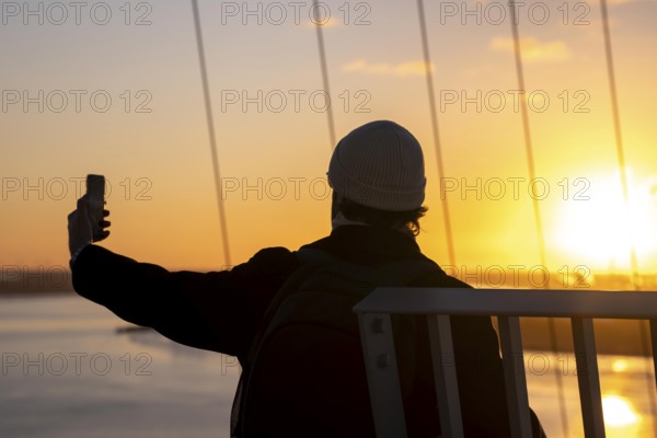 Selfie at sunset on the viewing platform of the Atlantic Sail City Hotel Hochhaus, view over the whole of Bremerhaven