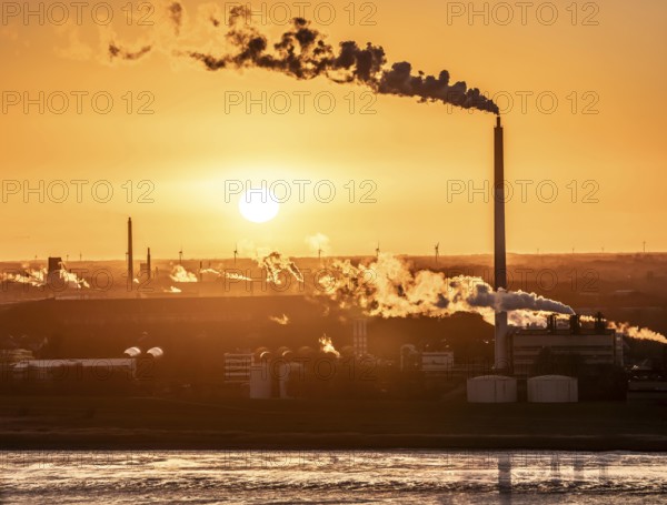 Kronos Titan chemical plant, one of the world's leading manufacturers of titanium dioxide, in Nordenham, Bremerhaven, sunset, Germany