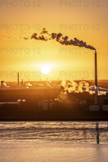 Kronos Titan chemical plant, one of the world's leading manufacturers of titanium dioxide, in Nordenham, Bremerhaven, sunset, Germany