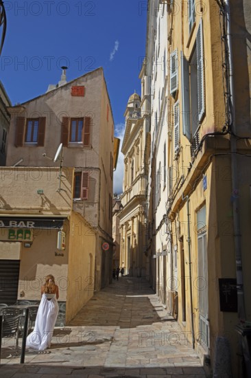 Old town alleyway, in the back the church of Saint Jean-Baptiste à Bastia or church of St. John the Baptist, old town, Bastia, Haute-Corse department, Corsica, France