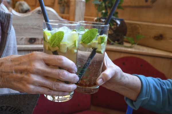 Toasting health with cocktails, Bavaria, Germany