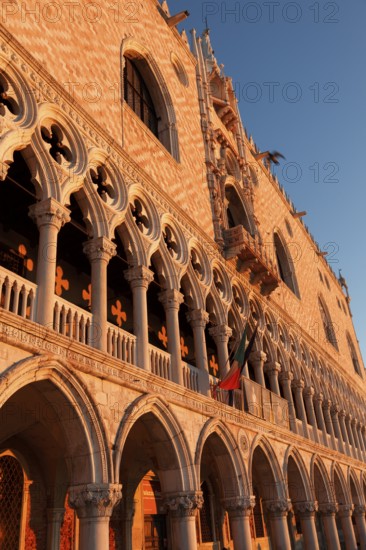Sun rays at sunrise on the façade of the Doge's Palace, Venice, Veneto, Italy