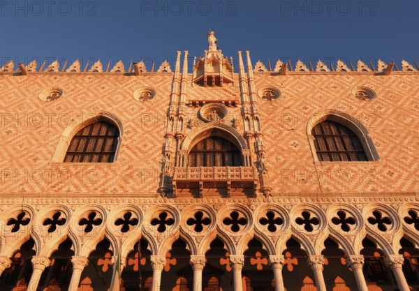 Sun rays at sunrise on the façade of the Doge's Palace, Venice, Veneto, Italy