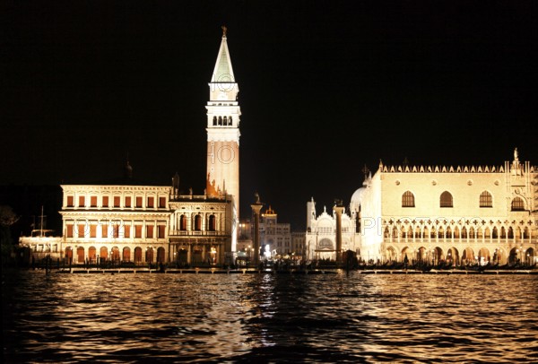 Illuminated Piazzetta San Marco with the granite columns, the Biblioteca Nationale Marciana, the Doge's Palace, the Basilica San Marco, the Campanille, San Marco, Venice, Veneto, Italy