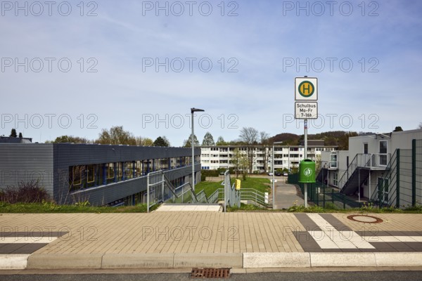 School bus stop, Hauptschule Mathilde - Anneke - school, houses, modern buildings, apartment buildings, residential buildings, lantern, trees, meadow, diffuse light, milky blue sky, cirrostratus clouds, Dresdener Straße, Sprockhövel, Ennepe-Ruhr-Kreis, North Rhine-Westphalia, Germany