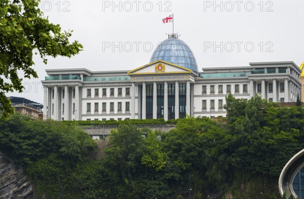 Large government building with dome and flag on a green hill, state palace for ceremonies, Avlabari residence or presidential palace, Tbilisi, Tbilisi, Georgia
