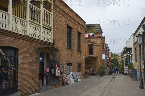 Historic brick buildings and shops along a quiet street, Old Town, Tbilisi, Tbilisi, Georgia