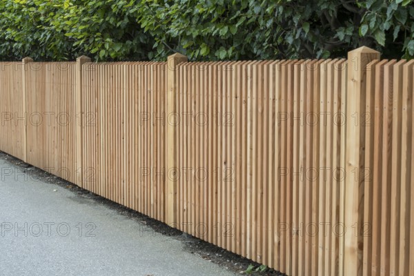 Wooden fence on the side of the road, vertical slats, town of Tegernsee, Upper Bavaria, Bavaria, Germany