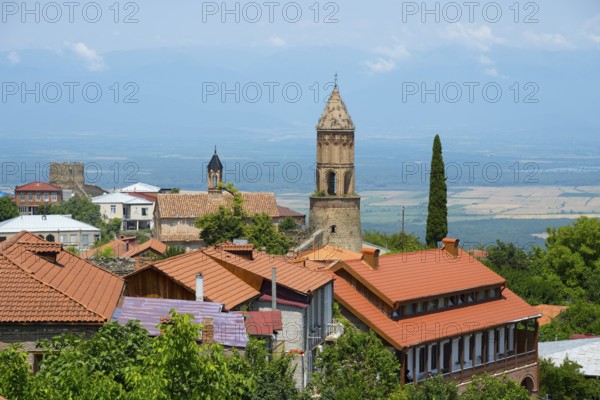 View of an urban landscape with a church tower and views to the horizon, Church of St. George, Sighnaghi, Signagi, Kakheti Province, Greater Caucasus, Georgia, Western Asia