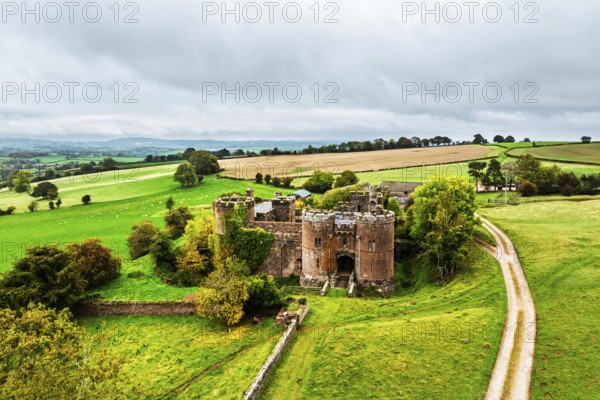 DefaultAutumn Colours over ruins of Pembridge Castle or Newland Castle from a drone, Herefordshire, England, United Kingdom