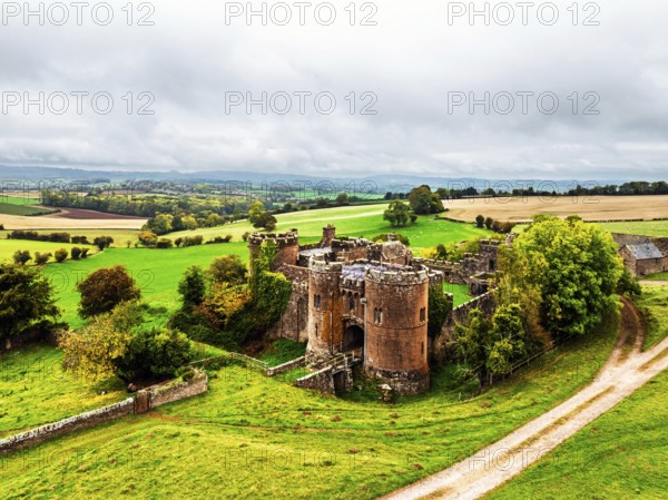 Autumn Colours over ruins of Pembridge Castle or Newland Castle from a drone, Herefordshire, England, United Kingdom