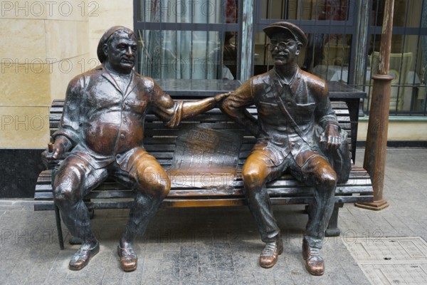 Two bronze sculptures of men on a bench in humorous depiction, 'Two Old Friends, Chavteli Street, Tbilisi, Tbilisi, Georgia