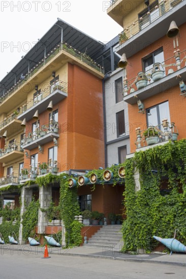 Multi-storey residential building with colorful facades, balconies and lots of greenery, Brim Hotel, Tbilisi, Tbilisi, Georgia