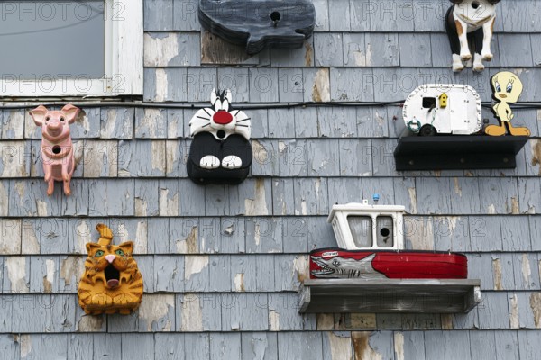 Handmade birdhouses, cartoon characters, decoration, facade detail, Perkins Cove, Ogunquit, Maine, New England, USA