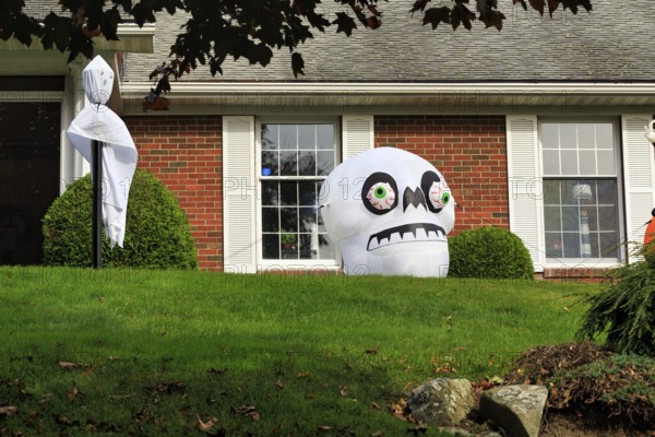 Ghost and skull in front garden Halloween decoration, Ogunquit, Maine, New England, USA