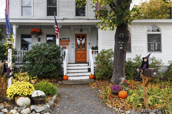 Typical American house in autumn, white wooden house with porch and front garden, guest room, booked out, decoration for Halloween, Ogunquit, Maine, New England, USA