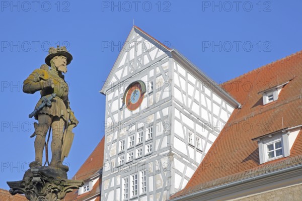 Emperor Maximilian II sculpture built in 1570 at Marktbrunnen, Holy Roman Empire, Habsburg, knight with sword, and half-timbering from the hospital courtyard built 13th century, Maximilian Fountain, Market Square, Reutlingen, Swabian Jura, Baden-Württemberg, Germany
