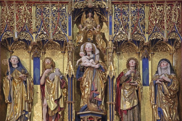 Late Gothic high altar by sculptor Jörg Syrlin the Younger of the Ulm School built in 1494, from left to right founder Benedict, John the Baptist, Madonna figure with baby Jesus, Saint John the Evangelist, scholastics, wood carvings, monastery church, interior view, winged altar, handicraft, work of art, decorations, figures, Benedictine monastery, Blaubeuren, Swabeburen Iberian Alps, Baden-Württemberg, Germany