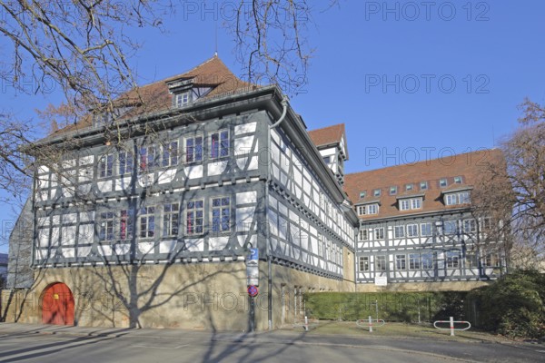 Historic half-timbered house built in 14th century and Friedrich-List-Gymnasium, Reutlingen, Swabian Alb, Baden-Württemberg, Germany