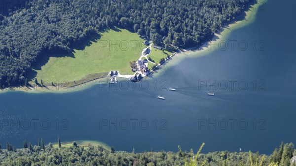 Deep view from Feuerpalfen of Lake Königssee with St. Bartholomä and some ships, Berchtesgaden National Park, Bavaria, Germany