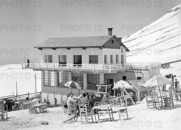 Male skiers at ski lift cafe, Cedars Ski Resort, Bsharri, Lebanon, Middle East c 1956 - the country's oldest skiing area and first ski lift built in 1953